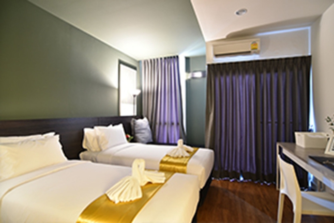 Imagen de la habitación del Hotel The Wind Holiday. Foto 9