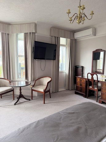 Imagen de la habitación del Hotel The Windsor House. Foto 9