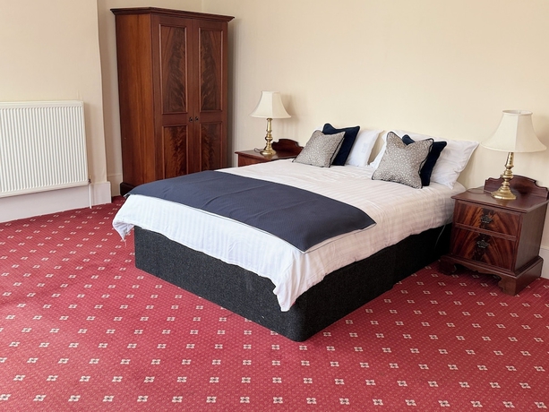 Imagen de la habitación del Hotel The Windsor House. Foto 12
