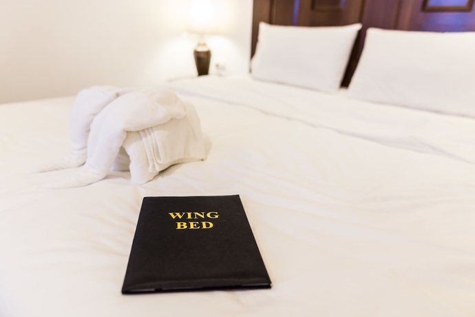 Imagen de la habitación del Hotel The Wing Lanna. Foto 13