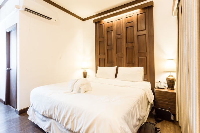 Imagen de la habitación del Hotel The Wing Lanna. Foto 14