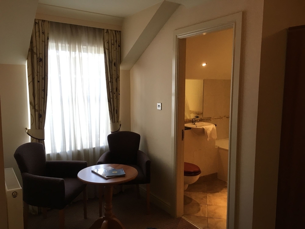 Imagen de la habitación del Hotel The Winnock Hotel. Foto 10