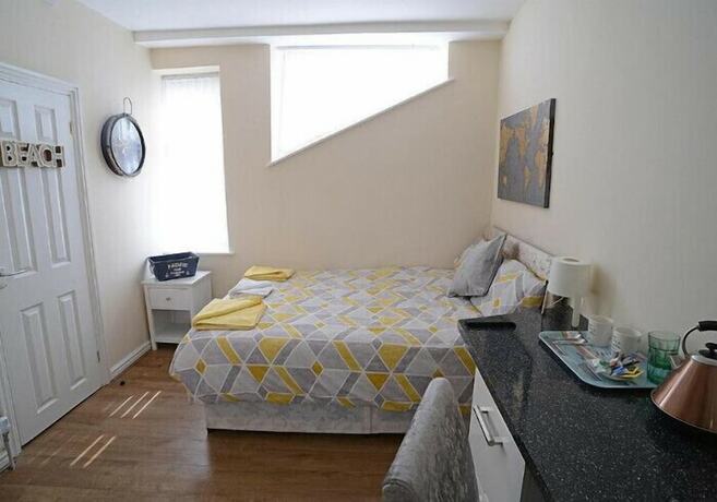 Imagen de la habitación del Hotel The Winter Garden Suites. Foto 20