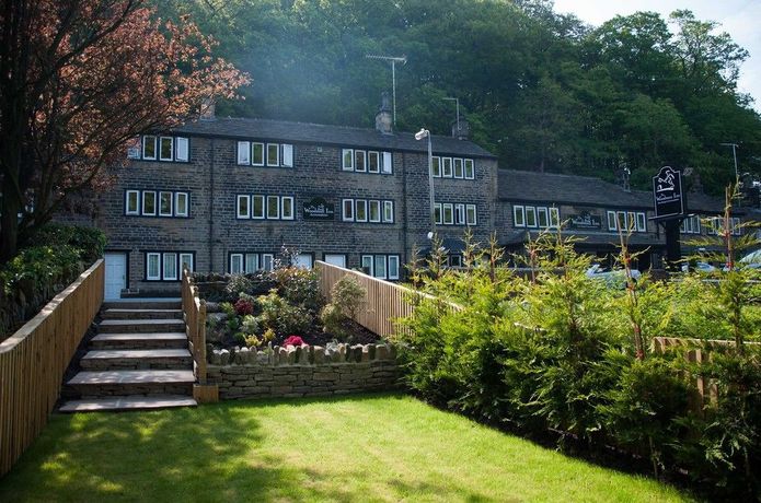 Imagen de los exteriores del Hotel The Woodman Inn. Foto 12