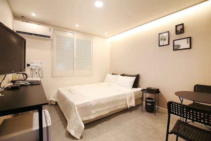 Imagen de la habitación del Hotel The Zam. Foto 10