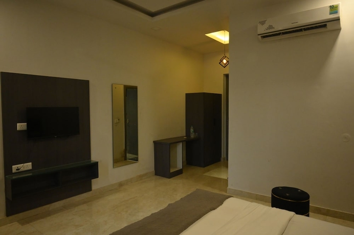 Imagen de la habitación del Hotel The carnation mound. Foto 7