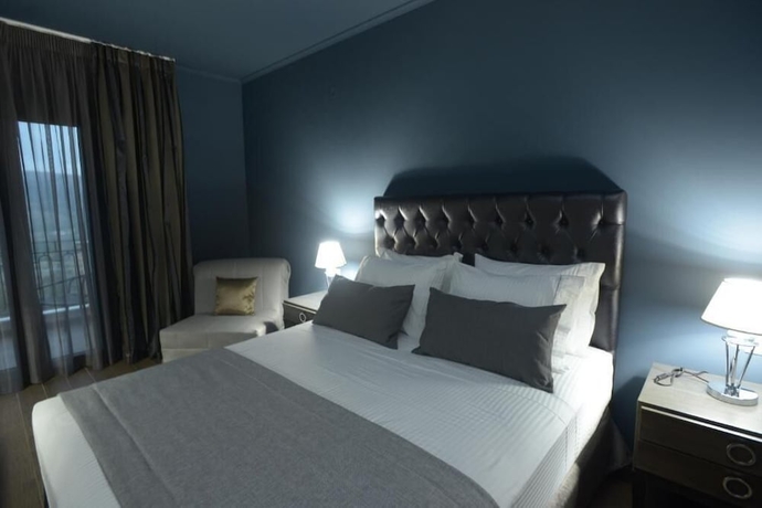 Imagen de la habitación del Hotel Theasis. Foto 19