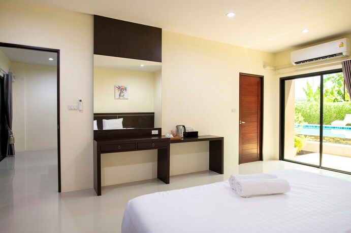 Imagen de la habitación del Hotel Thip Thip. Foto 21