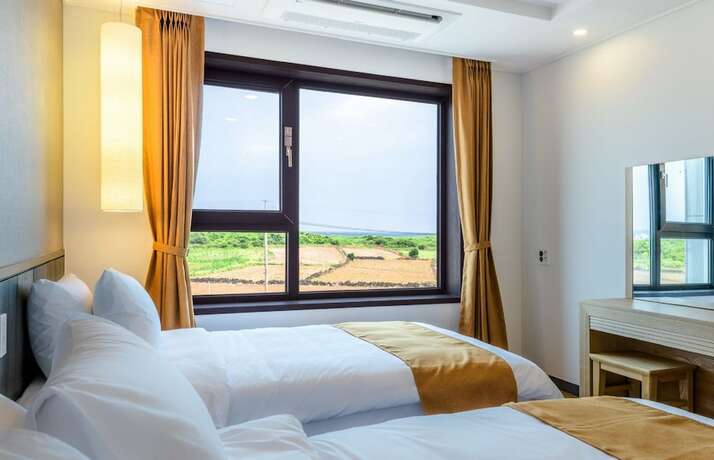 Imagen de la habitación del Hotel Thira, Seongsan-eup. Foto 19
