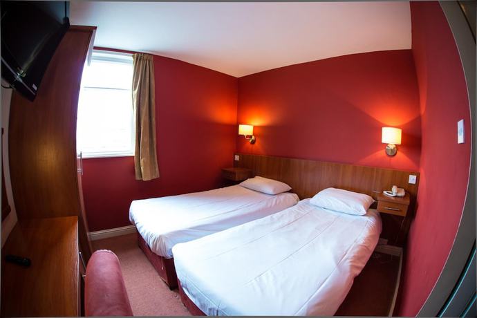 Imagen de la habitación del Hotel Thomas James. Foto 13