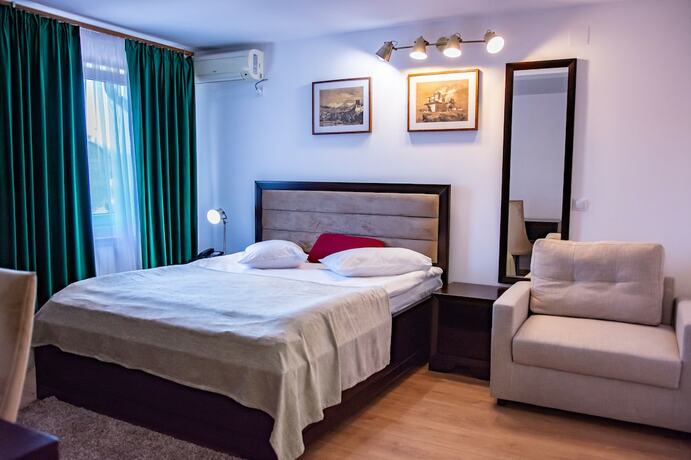 Imagen de la habitación del Hotel Thr center. Foto 19