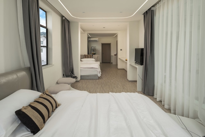 Imagen de la habitación del Hotel Three Colours Yunhe Erhai. Foto 6