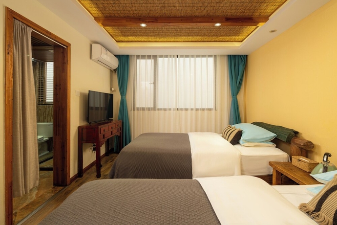 Imagen de la habitación del Hotel Three Colours Yunhe Erhai. Foto 11