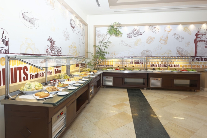 Imagen del bar/restaurante del Hotel Three Corners Sea Beach Resort. Foto 5