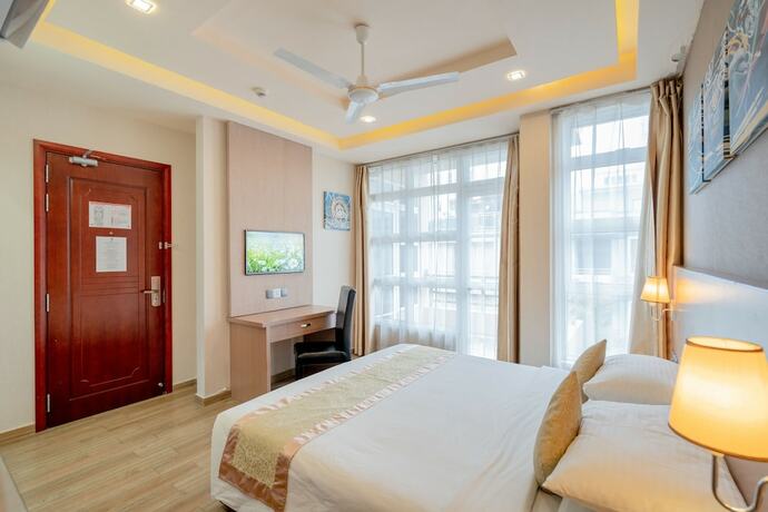 Imagen de la habitación del Hotel Three Inn. Foto 14