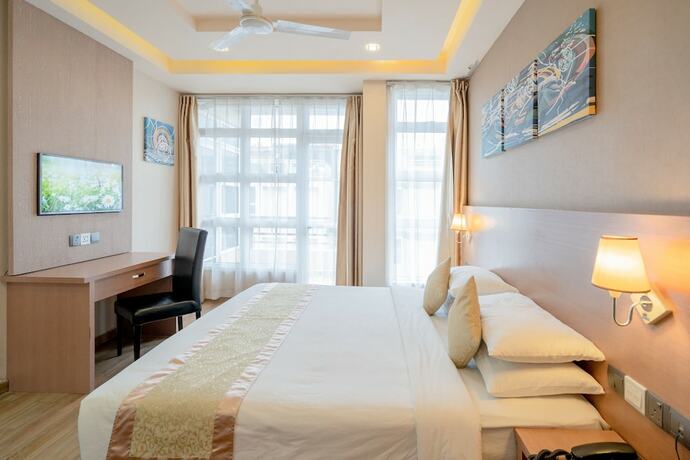 Imagen de la habitación del Hotel Three Inn. Foto 16