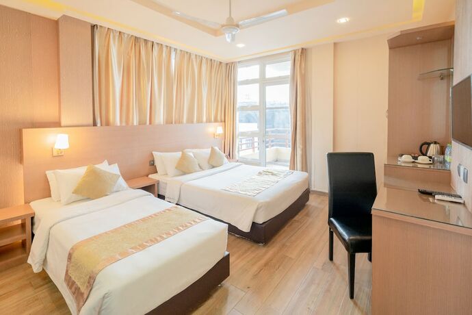 Imagen de la habitación del Hotel Three Inn. Foto 18