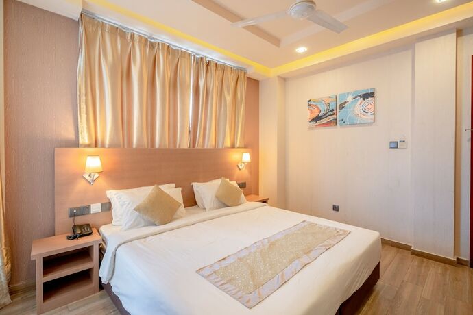 Imagen de la habitación del Hotel Three Inn. Foto 19