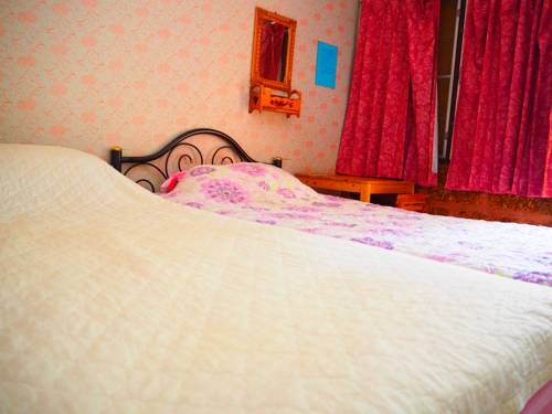 Imagen de la habitación del Hotel Three J Guesthouse. Foto 8