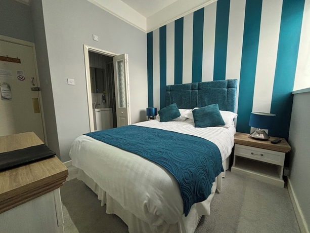 Imagen de la habitación del Hotel Three palms. Foto 3
