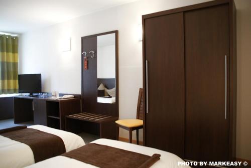 Imagen de la habitación del Hotel Threeland. Foto 7