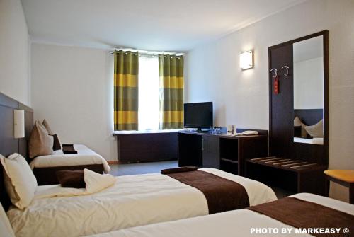 Imagen de la habitación del Hotel Threeland. Foto 8