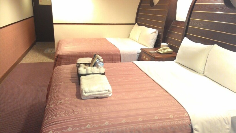 Imagen de la habitación del Hotel Ti Hwa. Foto 14