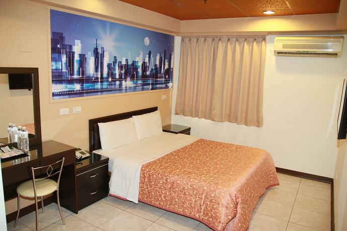 Imagen de la habitación del Hotel Ti Hwa. Foto 15