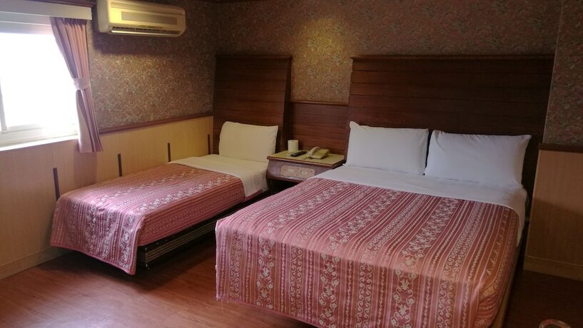 Imagen de la habitación del Hotel Ti Hwa. Foto 17