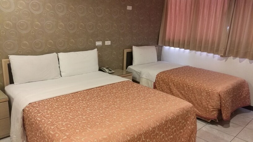 Imagen de la habitación del Hotel Ti Hwa. Foto 18