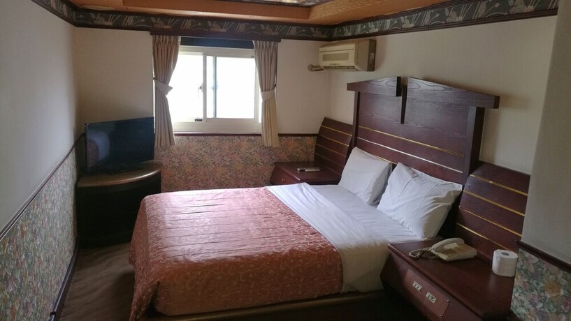 Imagen de la habitación del Hotel Ti Hwa. Foto 21