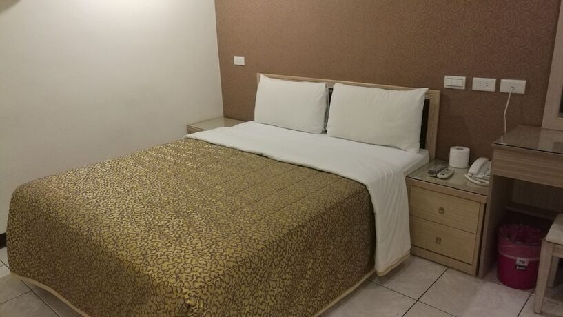 Imagen de la habitación del Hotel Ti Hwa. Foto 24