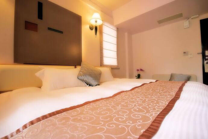 Imagen de la habitación del Hotel Tian Long. Foto 20