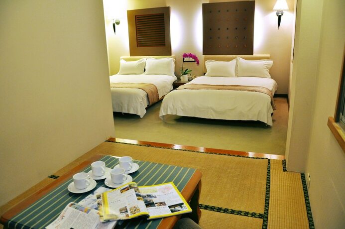 Imagen de la habitación del Hotel Tian Long. Foto 21