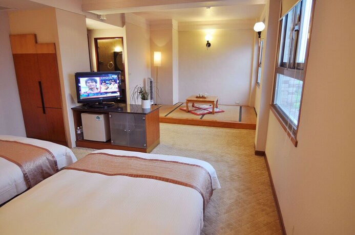 Imagen de la habitación del Hotel Tian Long. Foto 24