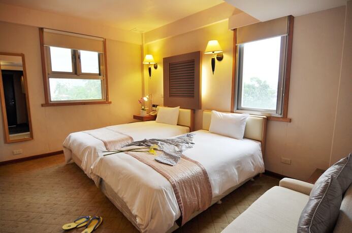 Imagen de la habitación del Hotel Tian Long. Foto 25