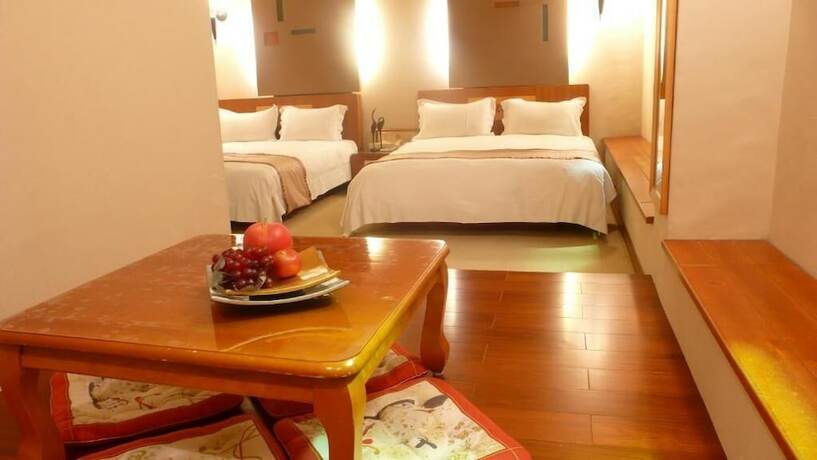 Imagen de la habitación del Hotel Tian Long. Foto 27
