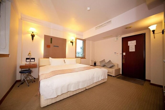 Imagen de la habitación del Hotel Tian Long. Foto 28