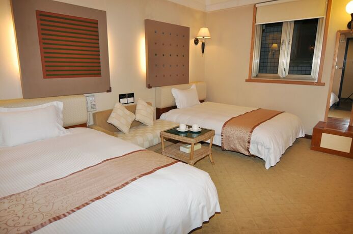 Imagen de la habitación del Hotel Tian Long. Foto 29