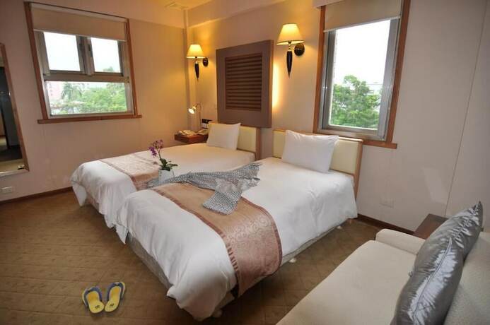 Imagen de la habitación del Hotel Tian Long. Foto 30