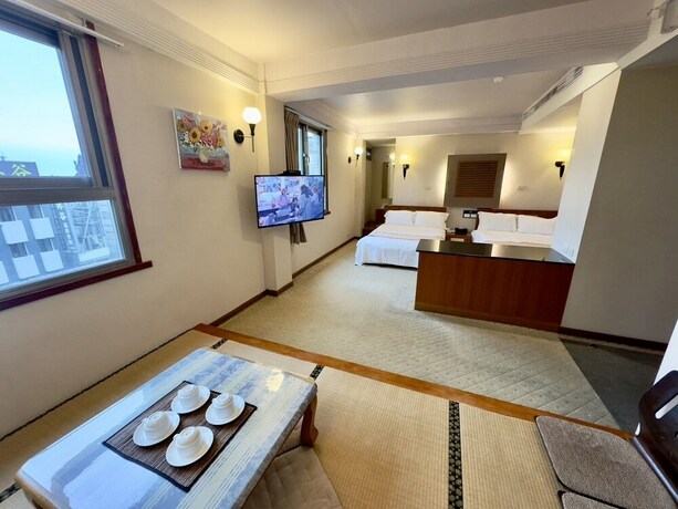 Imagen de la habitación del Hotel Tian Long. Foto 32