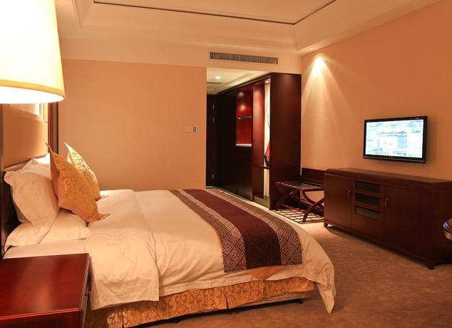 Imagen de la habitación del Hotel Tianbao Garden Hotel. Foto 10