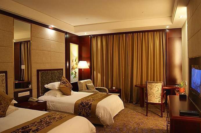 Imagen de la habitación del Hotel Tianbao Garden Hotel. Foto 11