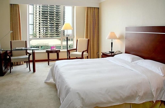 Imagen de la habitación del Hotel Tianbao International. Foto 2