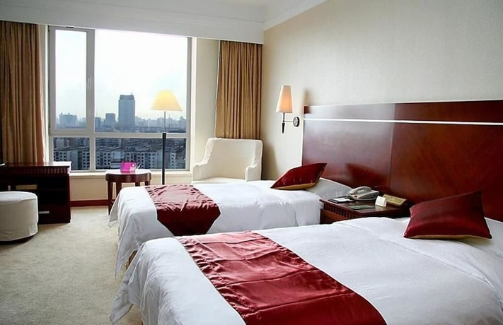 Imagen de la habitación del Hotel Tianbao International. Foto 8