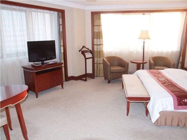 Imagen de la habitación del Hotel Tianijn Jinhuang Real Estate Golden Ocean. Foto 3