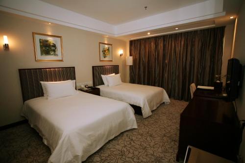 Imagen de la habitación del Hotel Tianjin All-legend International. Foto 6