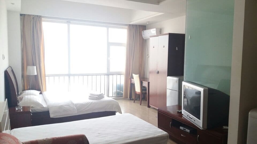 Imagen de la habitación del Hotel Tianjin Chaoju Apartment. Foto 9