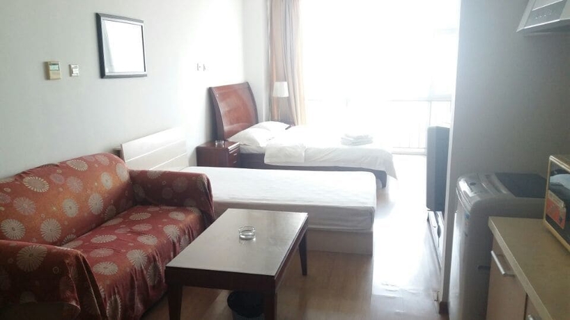 Imagen de la habitación del Hotel Tianjin Chaoju Apartment. Foto 12