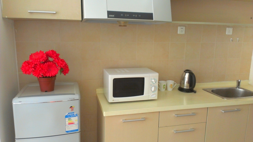 Imagen de la habitación del Hotel Tianjin Chaoju Apartment. Foto 15